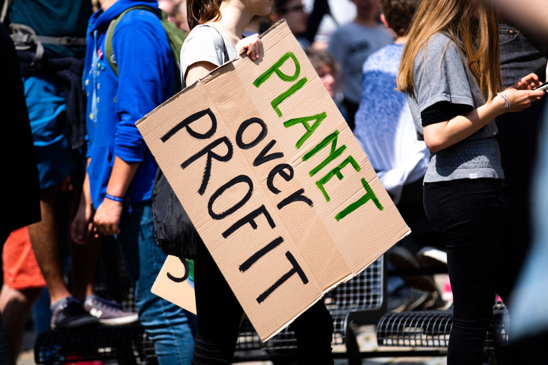 Planet over profit poster